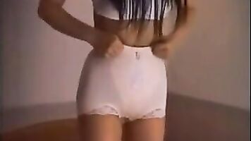 Asian GF trying on girdles inside the hotel room. 3