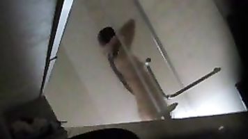 Asian chick recorded by voyeur while taking a shower.