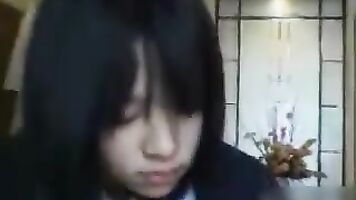Japanese schoolgirl giving blowjob.