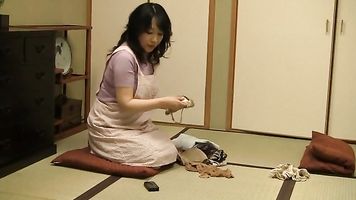 Hot mature Japanese AV Model in bondage gets tit fuck.