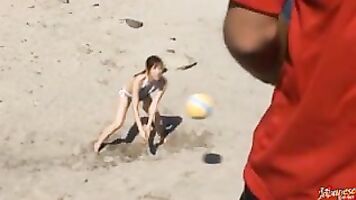 Delicious young MILF Rika Asao is on holiday with her cute Japanese friend, and in their sexy lue mini bikinis they play volleyball at the beach.