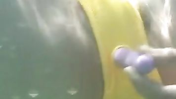 Rei Aokiﾴs taking a dip in the water, but her pussyﾴs even more wet than the water around her when these guys uses a vibrator against her clit to entice her.