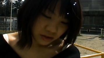 Kinky and cute Asian chick is masturbating in public.
